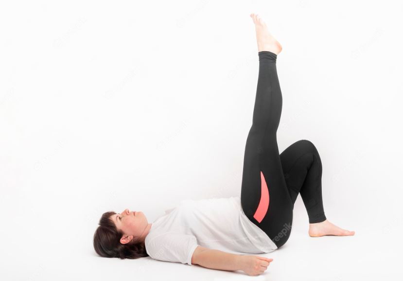 yoga pose lying on back knees bent